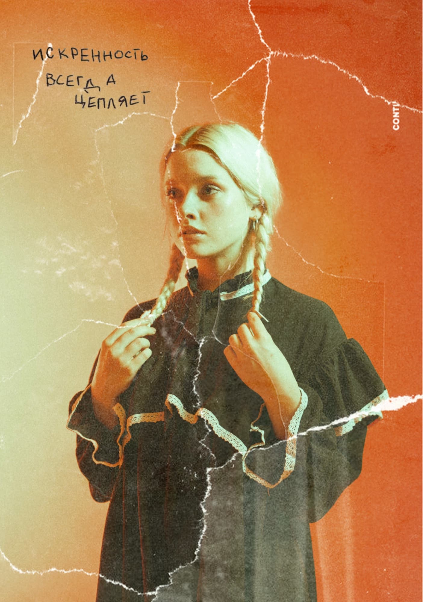 Young woman in a black coat against an orange painted wall