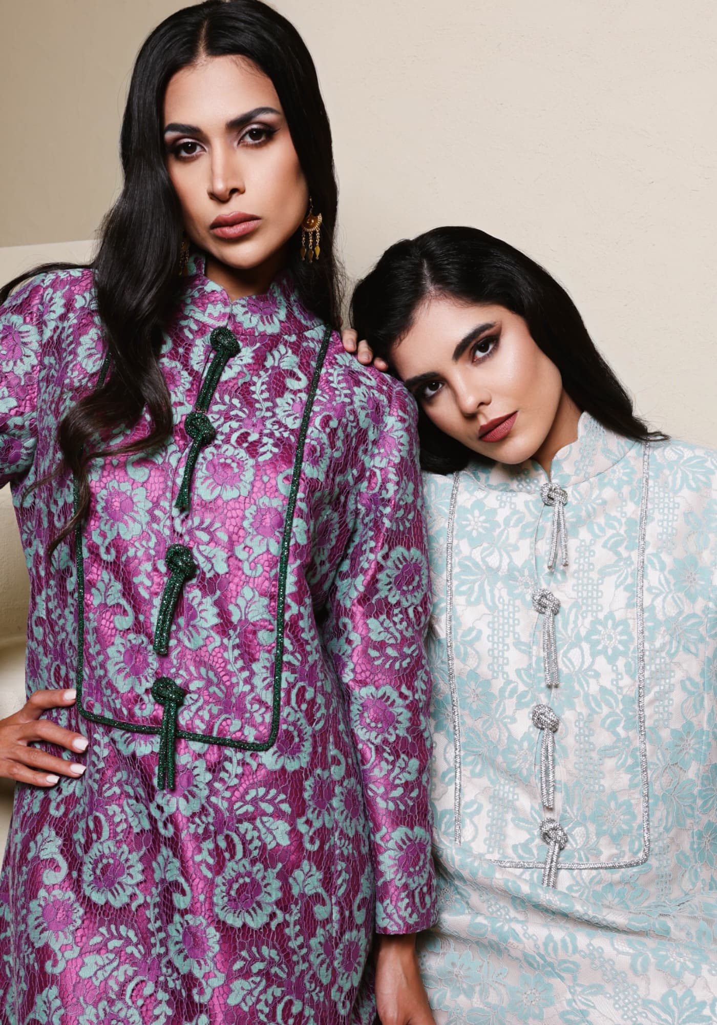 Two models in embroidered floral jackets